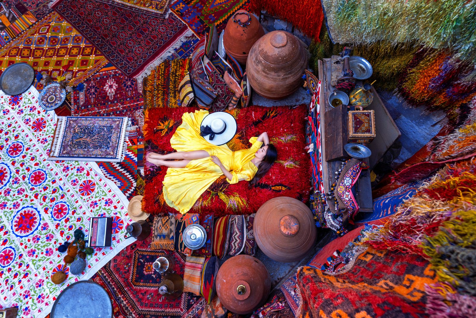 Beautiful girl at traditional carpet shop in Goreme city, Cappadocia in Turkey.