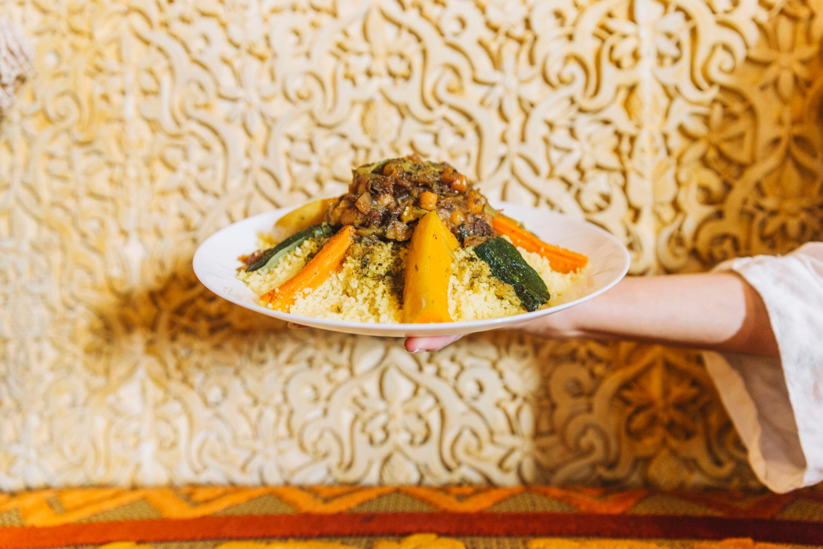 hand-holding-plate-arab-food